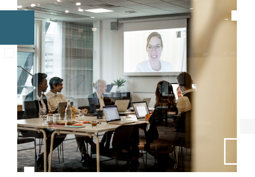Employees sitting in board room during a webinar on investor behaviours